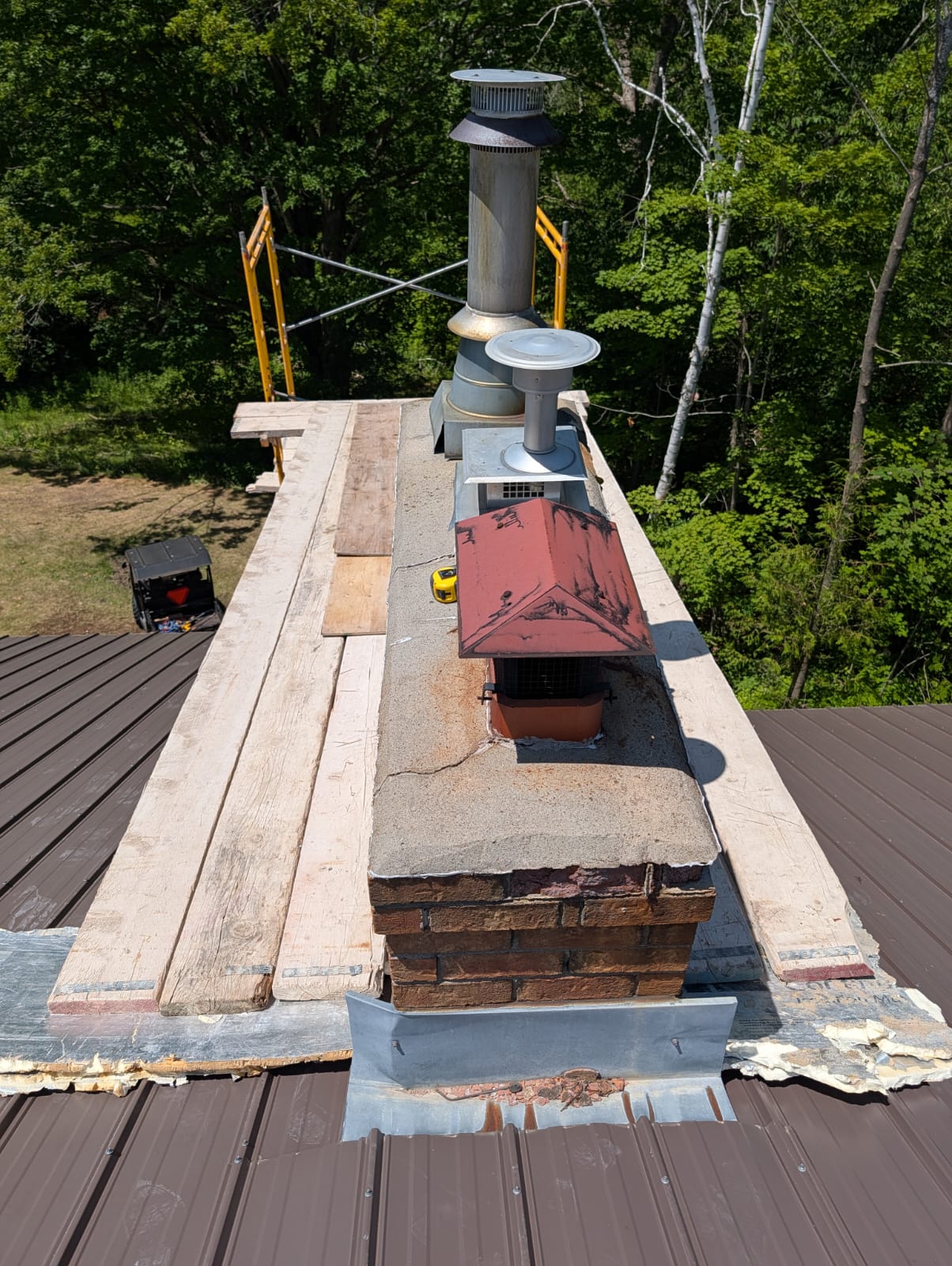 Aged brick chimney seen from the roof