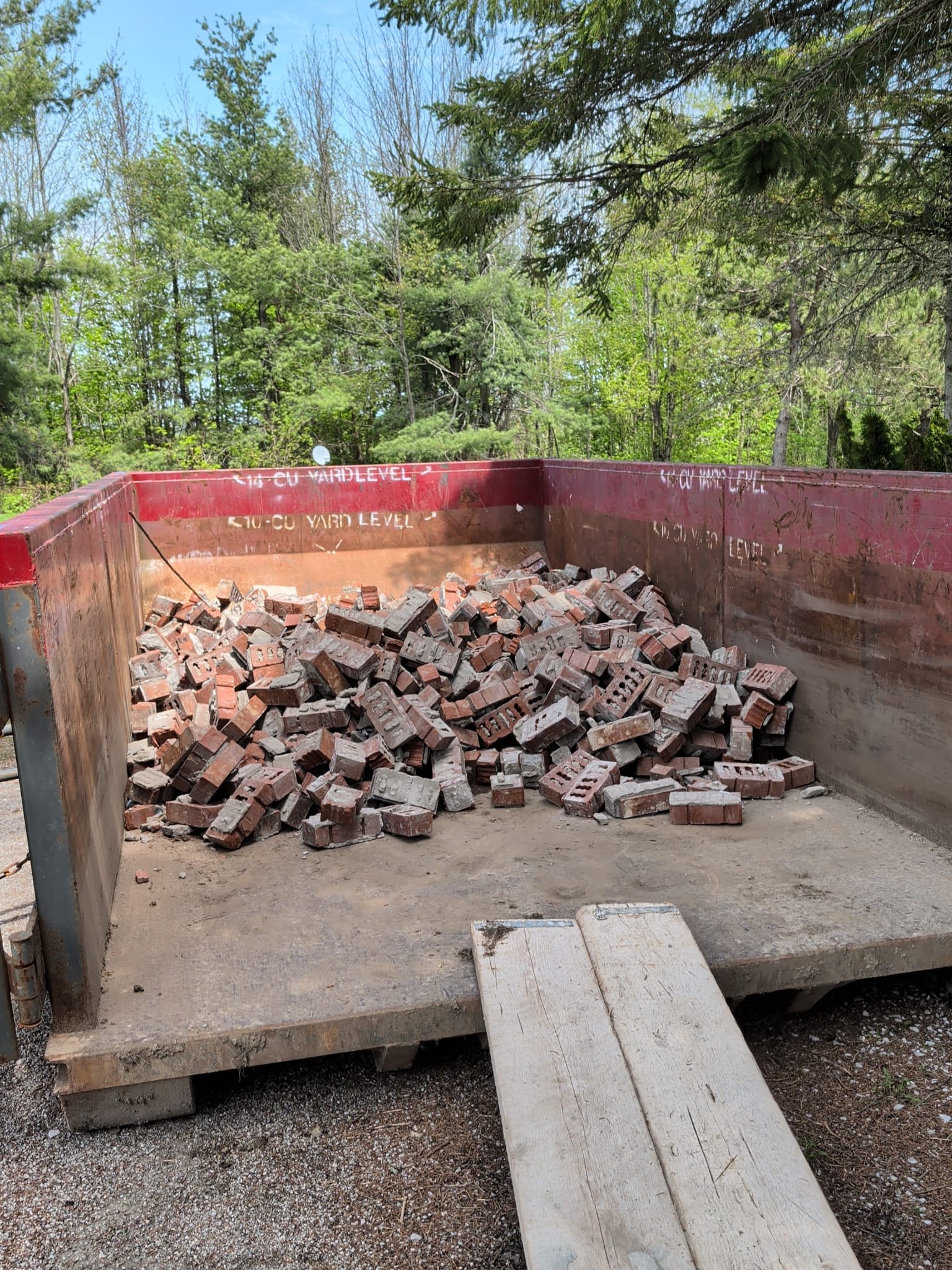 Dump bin filled with demolished brick