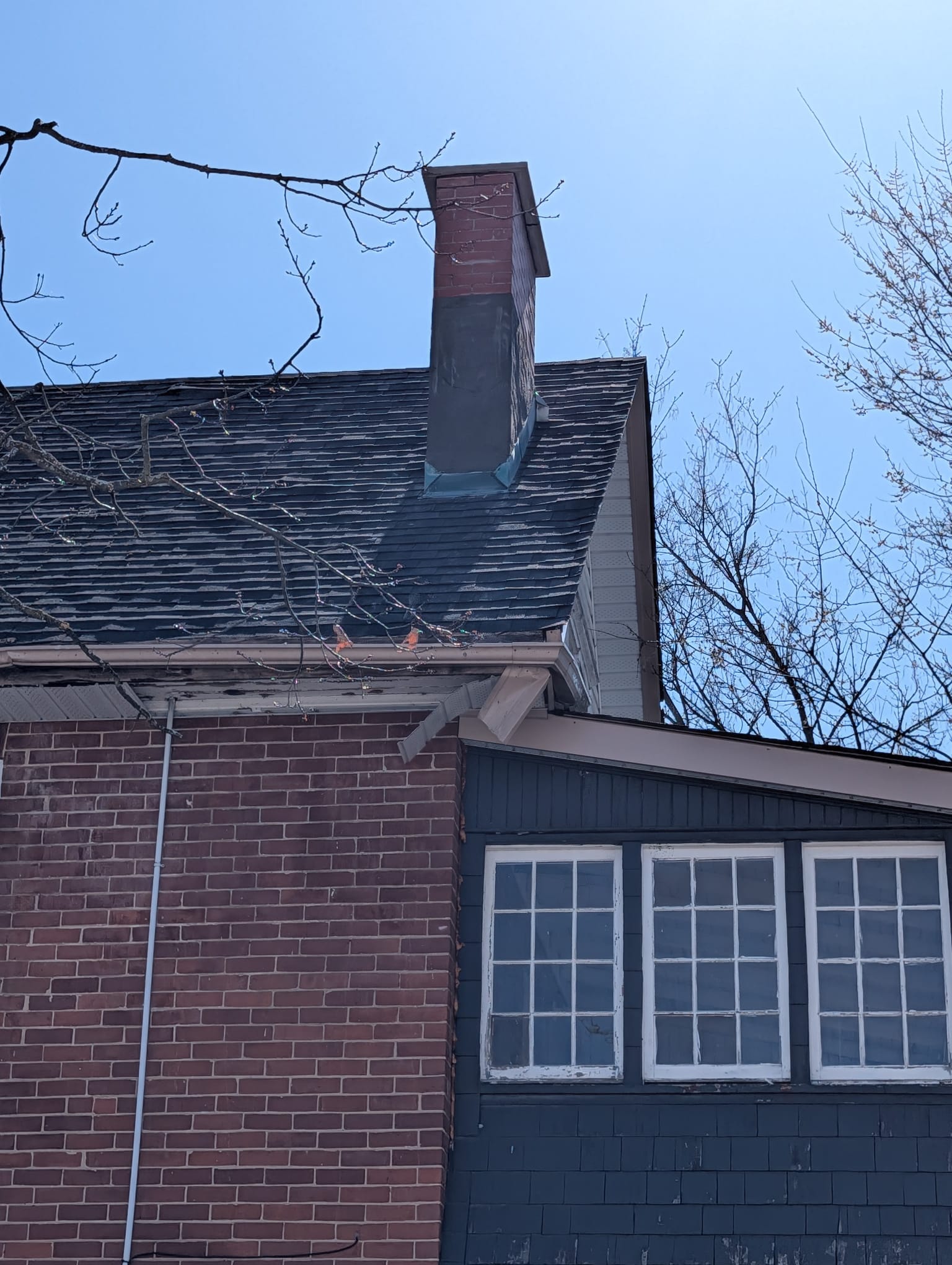 Brick chimney with new cap and flashing, from ground level